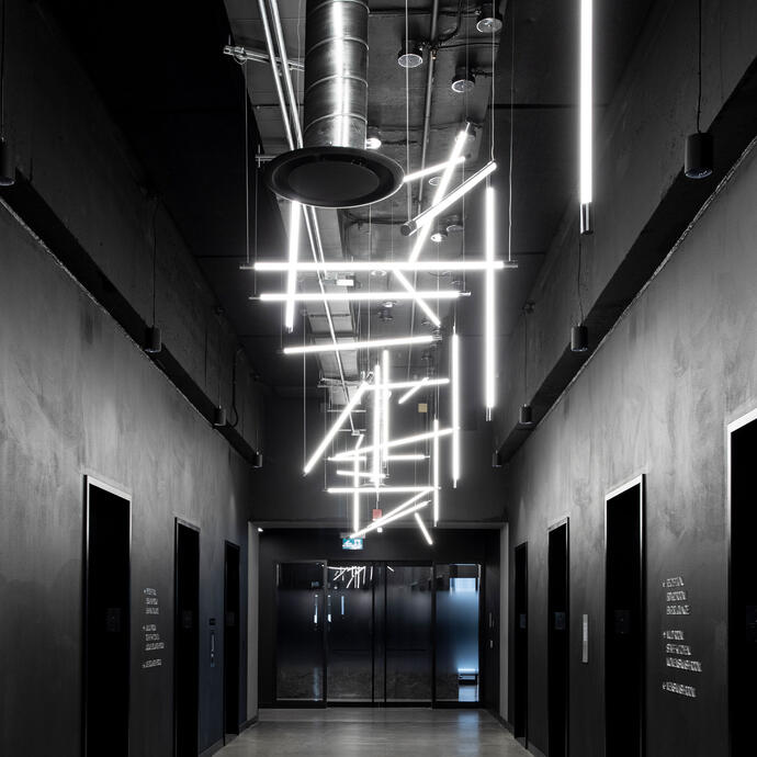 Office interior showing building systems in the ceiling.